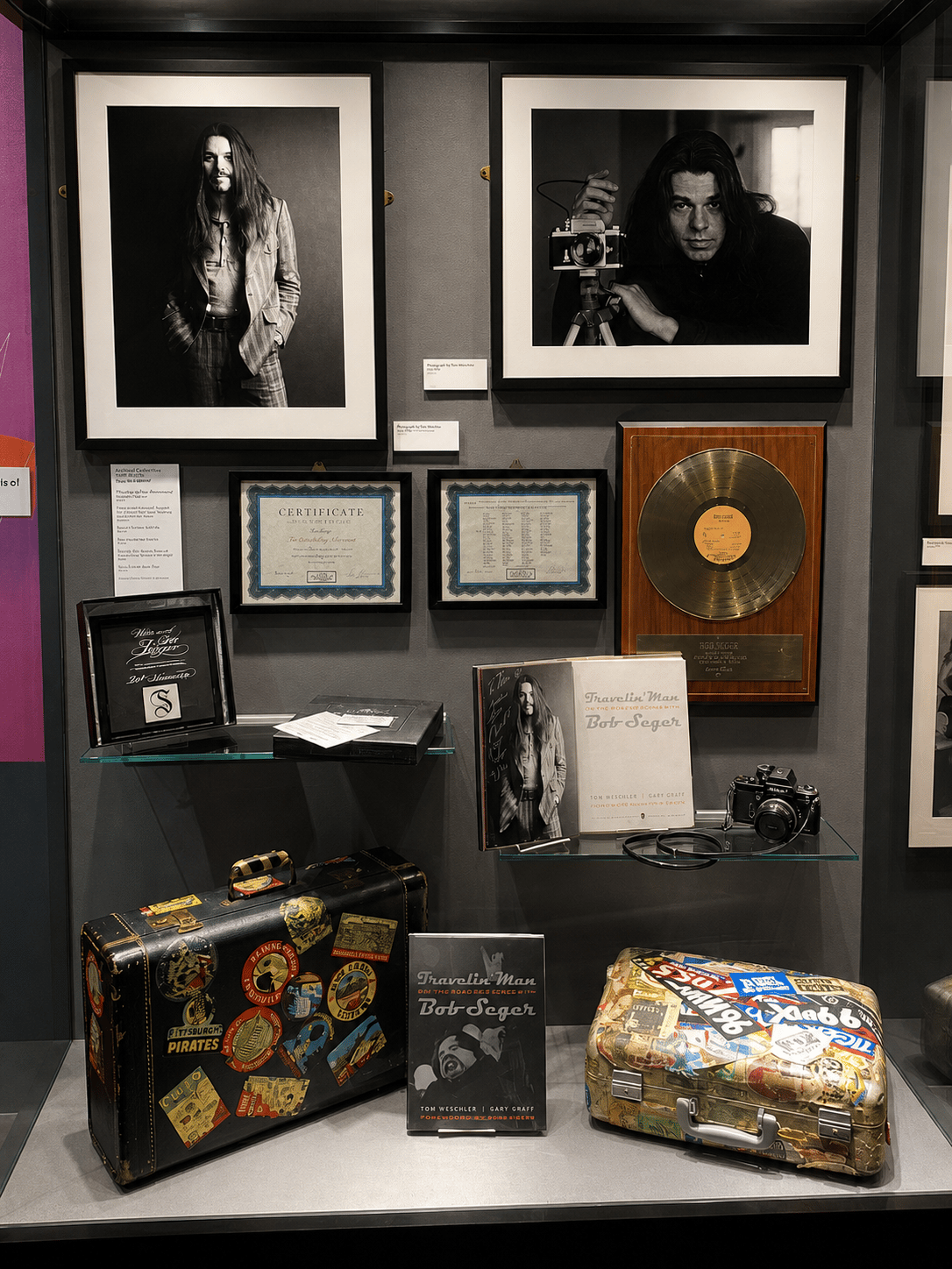 Travelin' Man Bob Seger exhibit display case with tour materials, camera, and archival objects