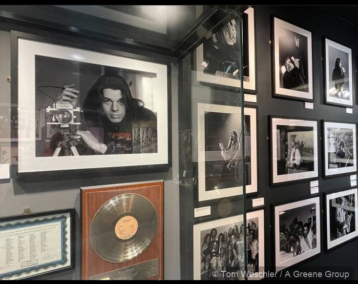 Travelin' Man exhibition installation with framed photography, archival materials, and display objects